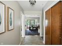 Hallway leading to the living room, features a patterned rug at 7736 Wawasee Dr, Indianapolis, IN 46250
