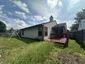 Spacious backyard features a wooden deck, perfect for outdoor entertaining at 8849 Summer Walk E Dr, Indianapolis, IN 46227