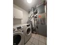 Functional laundry room features modern washer and dryer at 8849 Summer Walk E Dr, Indianapolis, IN 46227