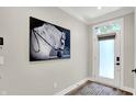 Bright foyer featuring a statement piece of art and natural light at 906 Berkhamsted Ln, Carmel, IN 46032