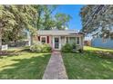 A charming home with a brick walkway leading to the front door, and an American flag at 917 W Busby St, Lebanon, IN 46052