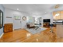 Inviting living room with beautiful floors, neutral rug, and a seamless flow into the kitchen area at 932 N Broadway St # 4, Indianapolis, IN 46202