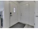 Bright entryway featuring gray flooring, and a secure door at 11117 Waterfield Pl, Indianapolis, IN 46235