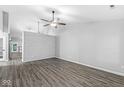 Spacious living room with wood-look floors, shiplap accent wall, and neutral paint at 11222 Boston Way, Fishers, IN 46038
