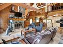 Cozy living room features a stone fireplace, wood beams, and comfortable seating at 1155 Cope Rd, Martinsville, IN 46151