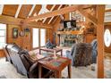 Inviting living room features a stone fireplace, wood accents, and comfortable leather seating at 1155 Cope Rd, Martinsville, IN 46151