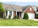 Attractive brick and siding home with a well-kept lawn and landscaping at 1173 Carlton Ct, Greenwood, IN 46143