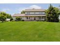 Beautiful two-story home with a well-kept lawn, complemented by mature trees and a cozy front porch at 12251 E 196Th St, Noblesville, IN 46060