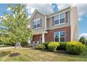 Charming two-story home with brick accents, well-maintained lawn and landscaping at 14453 Glapthorn Rd, Fishers, IN 46037