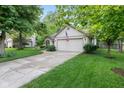 Ranch-style home with a well-maintained lawn, inviting curb appeal at 1482 Waterford Dr, Zionsville, IN 46077