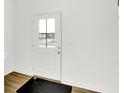 Bright entryway featuring a door with glass pane and hardwood floors at 2227 Foothill Dr, Greenfield, IN 46140