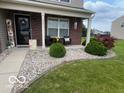Charming brick home featuring well-manicured landscaping and a welcoming front porch at 2231 Abbey St, Brownsburg, IN 46112