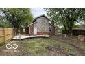 Spacious backyard features a wooden deck and lots of potential at 252 Ringwood Way, Anderson, IN 46013