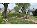 An angle view shows the house exterior and the surrounding neighborhood at 252 Ringwood Way, Anderson, IN 46013