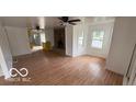 Bright living room features hardwood floors and a stone fireplace at 252 Ringwood Way, Anderson, IN 46013