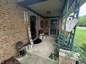 Inviting front porch with decorative elements, offering a cozy welcome with brick facade and seasonal decorations at 2937 S Allen Dr, New Palestine, IN 46163