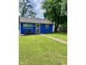 Cozy blue single-story home with a well-maintained lawn and charming front porch seating at 3464 N Bancroft St, Indianapolis, IN 46218