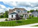 Beautiful home with a manicured lawn, landscaping, and inviting curb appeal at 3606 Evergreen Way, Zionsville, IN 46077