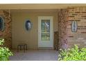 Cozy front porch with unique oval window, providing a welcoming entry to the home at 396 W 500 S, Anderson, IN 46013