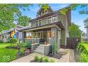 Charming two-story home with an inviting front porch and well-maintained landscaping at 4046 N Park Ave, Indianapolis, IN 46205