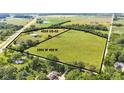 Aerial view of the lot at 4535 US-52 and 3502 W 450 N with a lush green landscape at 4535 N Us Hwy 52, Thorntown, IN 46071