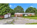 Charming single-story brick home with a detached garage and a spacious driveway at 4535 N Us Hwy 52, Thorntown, IN 46071