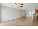 Bright living room with hardwood flooring, neutral walls, and abundant natural light at 5003 Opal Ridge Ln # 101, Indianapolis, IN 46237