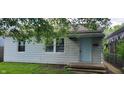 Charming single-Gathering home with a light blue door and a well-maintained lawn at 5344 Fletcher Ave, Indianapolis, IN 46219