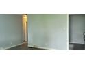 Empty living room with light-blue walls and electrical outlets at 5344 Fletcher Ave, Indianapolis, IN 46219