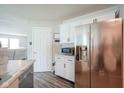 Modern kitchen featuring stainless steel appliances, bright white cabinets, and sleek countertops at 9775 Big Bend Dr, Indianapolis, IN 46234