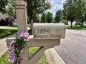 Close up of street address mailbox with decorative flowers at 13859 Keams Dr, Fishers, IN 46038