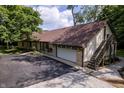 Sprawling home exterior featuring a large driveway, attached garage, and an exterior staircase at 14407 Bryn Mawr Dr, Fishers, IN 46038