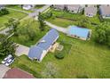 Aerial shot of home and property, showcasing backyard deck and outbuilding at 1624 Riley Rd, Lebanon, IN 46052