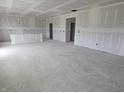 Large unfinished room with recessed lighting and several doorways at 235 Highland Ave, Danville, IN 46122