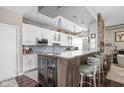 Modern kitchen with granite counters, stainless steel appliances, and a breakfast bar at 25 E 40Th St # Apt 1B/D, Indianapolis, IN 46205