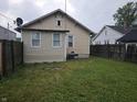 Large backyard with a well-maintained lawn and privacy fence, offering ample space for outdoor activities and relaxation at 2824 Brown St, Anderson, IN 46016