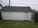 Spacious one-car garage offering secure parking and storage space, set in a well-maintained backyard at 2824 Brown St, Anderson, IN 46016