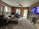 Cozy living room featuring hardwood accents, carpeted floors and plenty of natural light at 2824 Brown St, Anderson, IN 46016