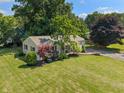 Aesthetic aerial showcasing the manicured lawn and mature landscaping of this suburban property at 2906 E 65Th St, Indianapolis, IN 46220
