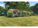 Beautifully landscaped yard complements the home's exterior at 2906 E 65Th St, Indianapolis, IN 46220