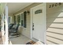 Inviting front porch with rocking chairs and a decorative front door at 2906 E 65Th St, Indianapolis, IN 46220