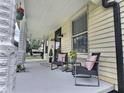 Covered front porch with comfortable seating, perfect for relaxing and enjoying the outdoors at 3015 Mckinley Ave, Columbus, IN 47201