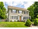 Attractive two-story home with green shutters and a well-maintained lawn at 4904 N Washington Blvd, Indianapolis, IN 46205