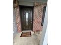 Close-up of the decorative front door and welcome mat at 6027 Moonseed Cir, Indianapolis, IN 46203
