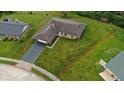 Aerial view of a residential property highlighting the house, surrounding lawn, and property boundary at 6851 Azalea Dr, Indianapolis, IN 46214