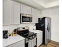 Well-equipped kitchen featuring modern appliances, ample counter space, and sleek cabinetry at 843 Garrow Dr, Westfield, IN 46074