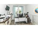 Bright home office with a large window, modern desk setup, and ample natural light at 9053 Fitzgerald Dr, Indianapolis, IN 46239