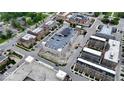 Bird's-eye view of a vibrant urban neighborhood featuring solar panels on top of parking structure at 925 Veterans Way # 101, Carmel, IN 46032