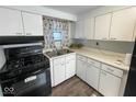 Well-lit kitchen equipped with modern appliances and sleek countertops at 10 Lincoln Cir, Elwood, IN 46036