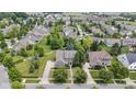 Expansive aerial view showcasing the property's lush landscaping and desirable neighborhood setting at 13624 Alston Dr, Fishers, IN 46037